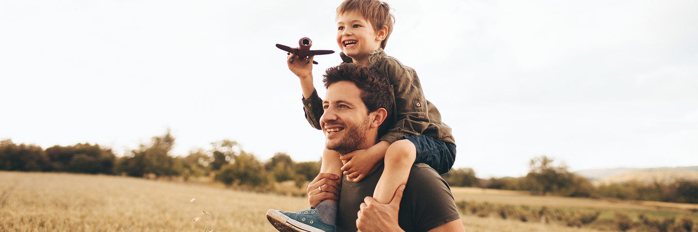 Father with his son on shoulders