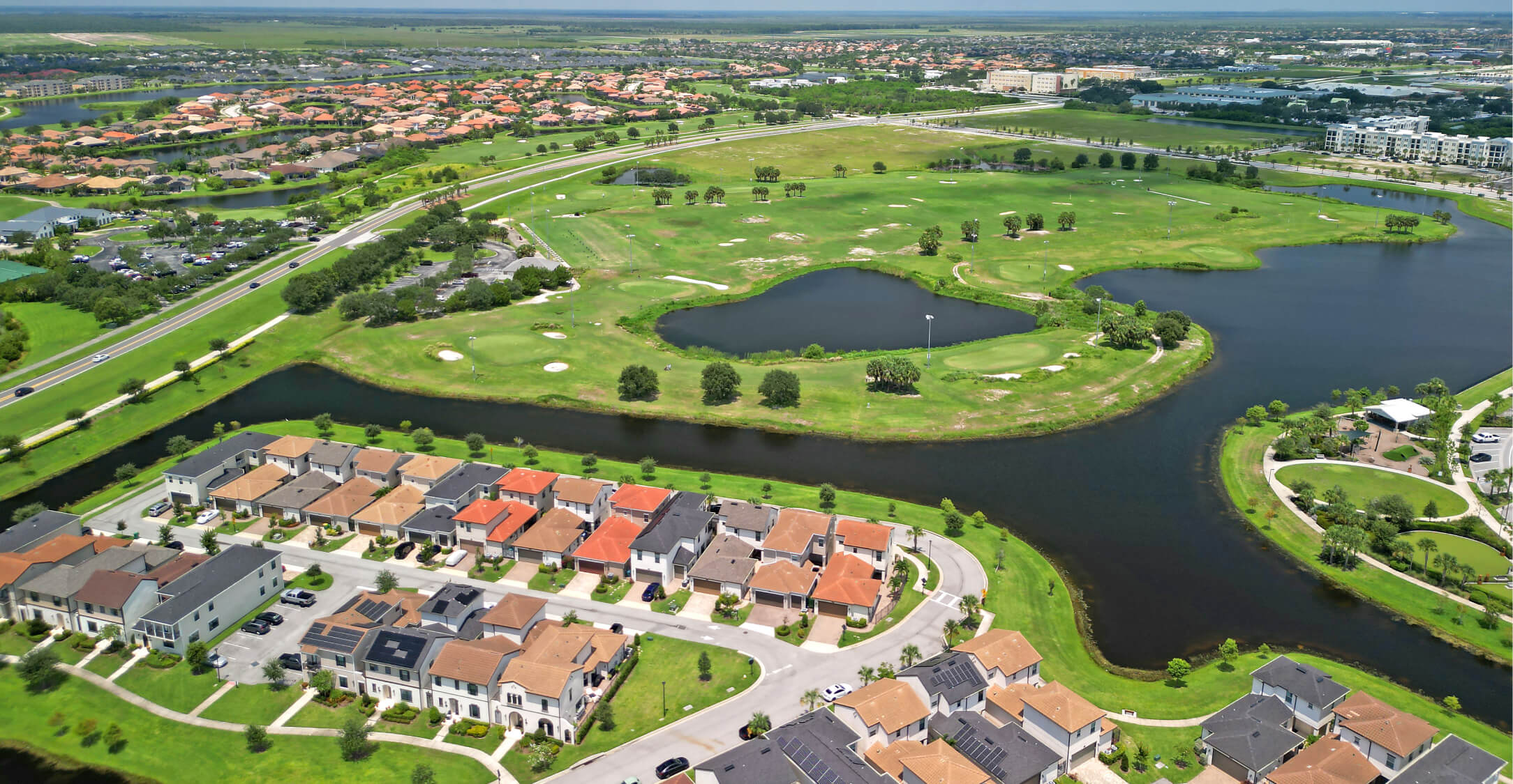 Aerial photograph of a neighborhood near a pond