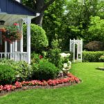 A home with a well maintained garden and flowerbed