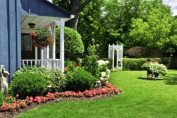 A home with a well maintained garden and flowerbed